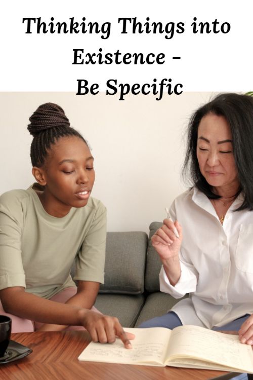 two women looking at a book and the words Thinking Things into Existence - Be Specific