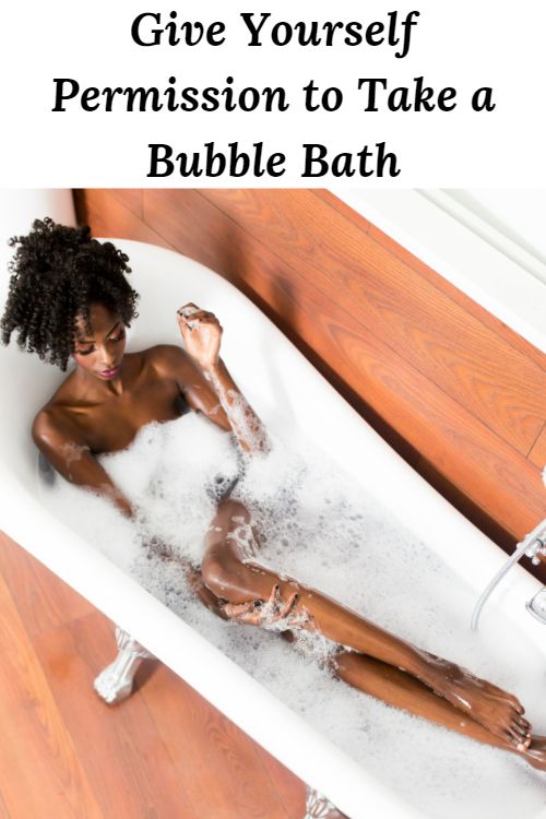 African American woman in a bubble bath and the words "Give Yourself Permission to Take a Bubble Bath"