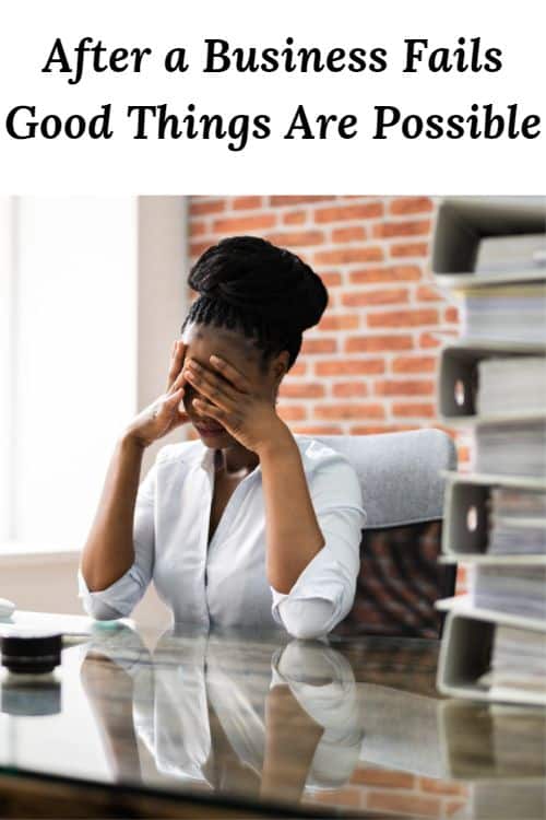 Sad African American woman at a desk with a stack of journals and the words "After a Business Fails Good Things Are Possible"