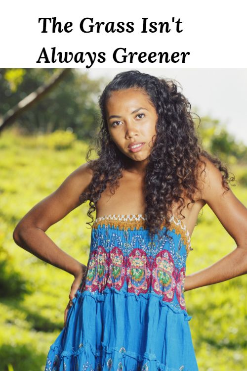 African American woman in a grassy field "The Grass Isn't Always Greener"