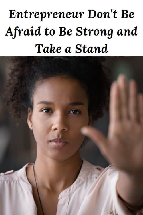 African American woman with hand raised in protest and the words "Entrepreneur - Dont Be Afraid to Be Strong and Take a Stand"