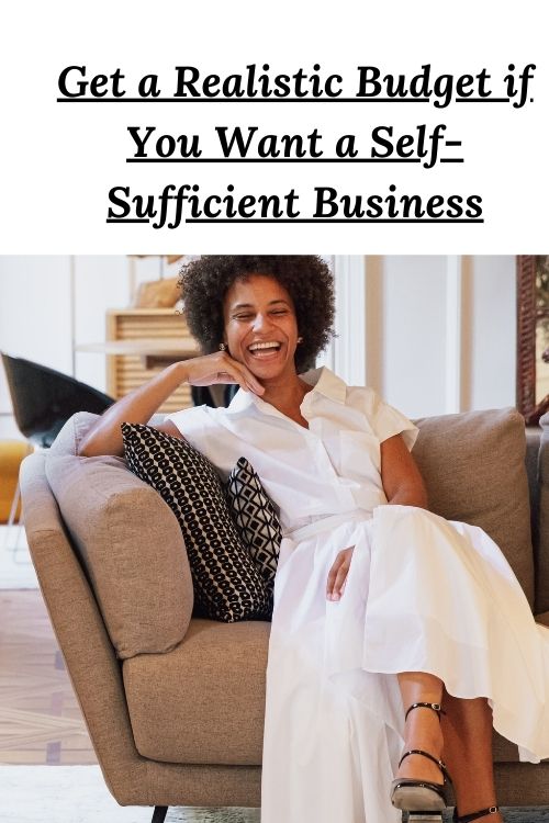 Happy African American woman sitting on a couch