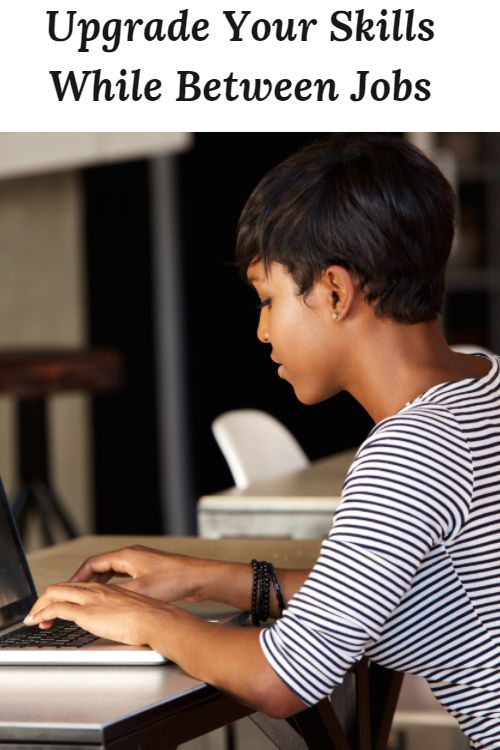 African American woman at a computer and the words "Upgrade Your Skills While Between Jobs"