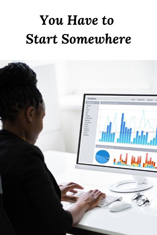 African American Woman with graphs and the words "You Have to Start Somewhere"