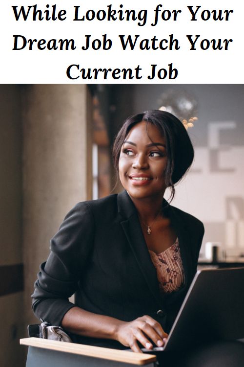 African American woman smiling with a laptop and the words "While Looking for Your Dream Job Watch Your Current Job"