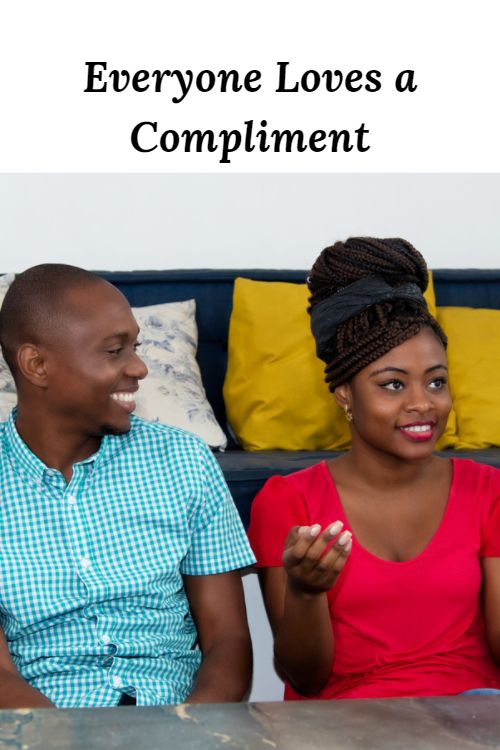 Happy African American couple and the words "Everyone Loves a Compliment"